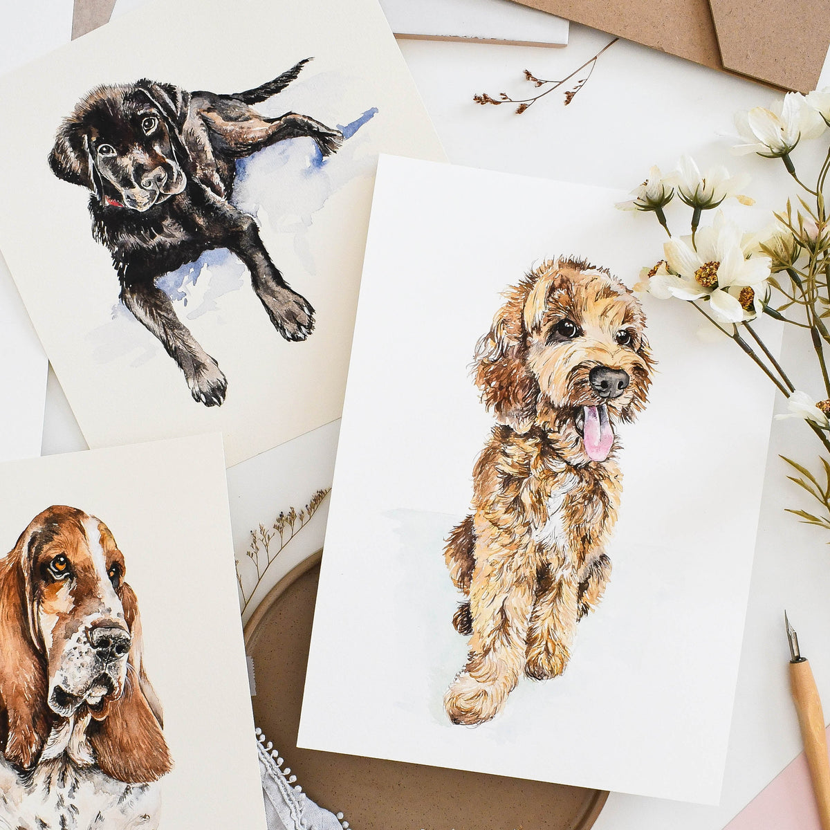 Three examples of original custom hand-painted dog portraits