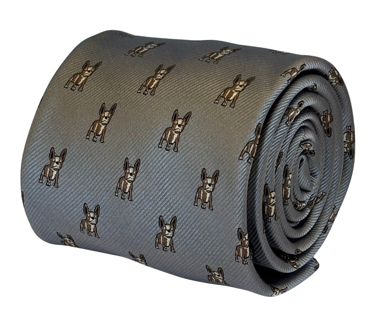 A rolled-up gray silk necktie featuring an all-over repeating pattern of small brown and black French Bulldog illustrations, shown against a plain white background.