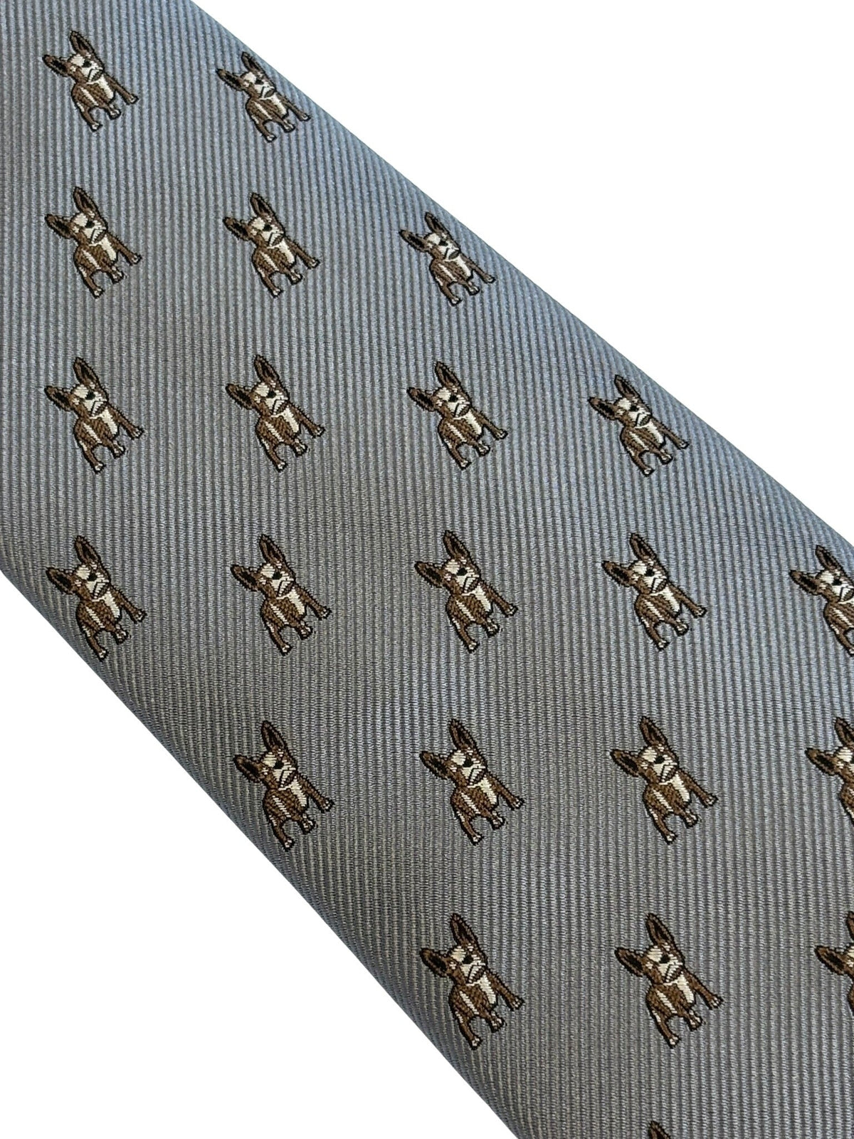A close-up of a gray necktie with a repeating pattern of small brown French Bulldog illustrations, set against a plain white background.
