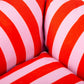 Close-up of red and pink striped dog bed