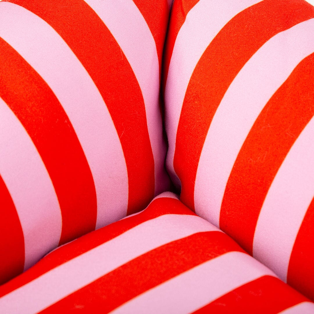 Close-up of red and pink striped dog bed