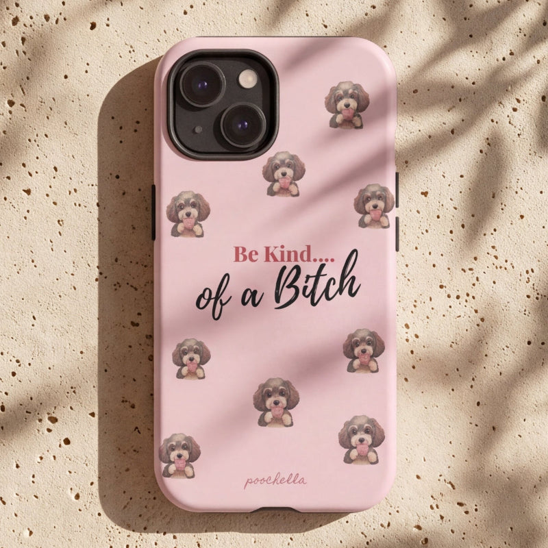 A light pink phone case with a pattern of small poodle illustrations and the text 'Be Kind.