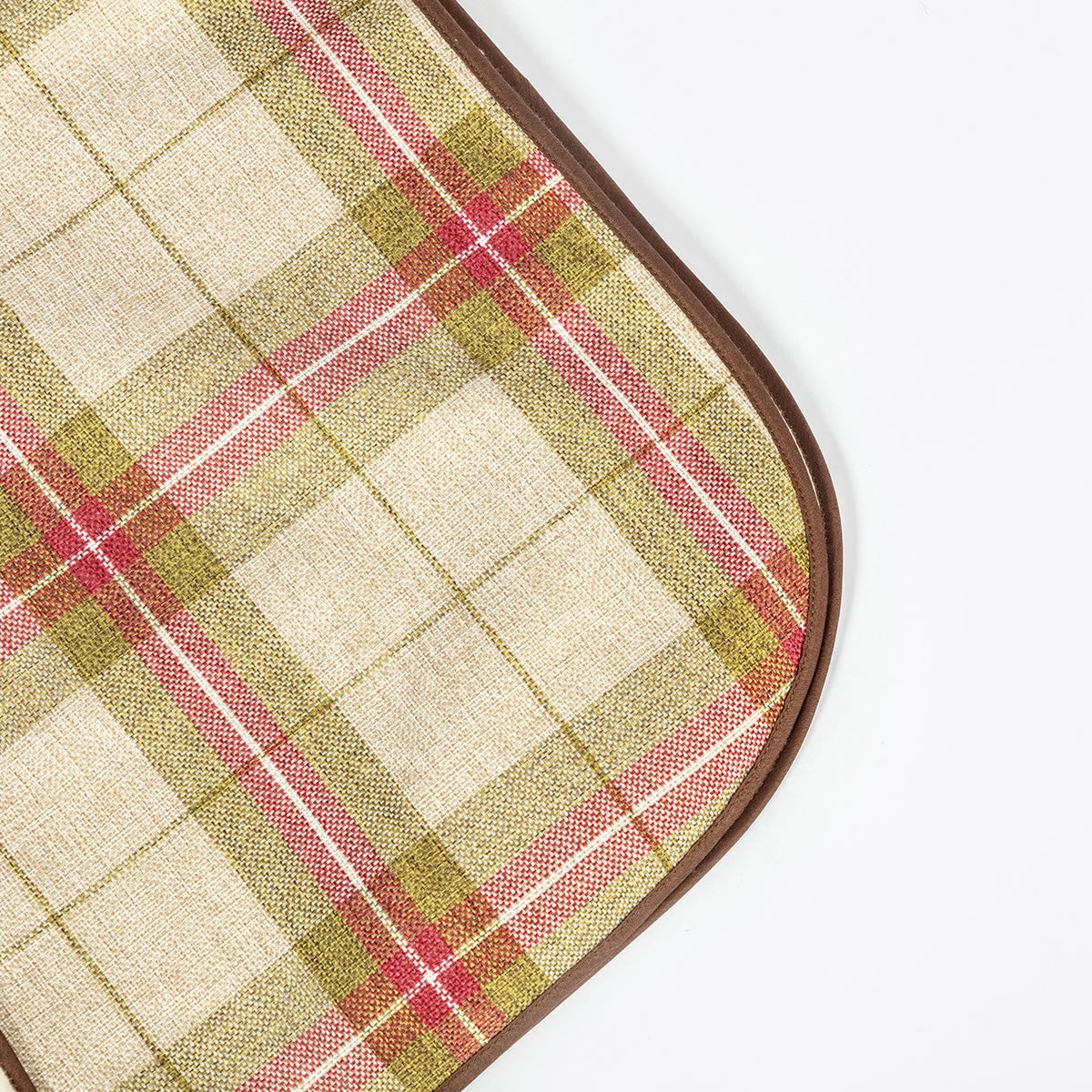 Plaid patterned mat with a brown border on a white background