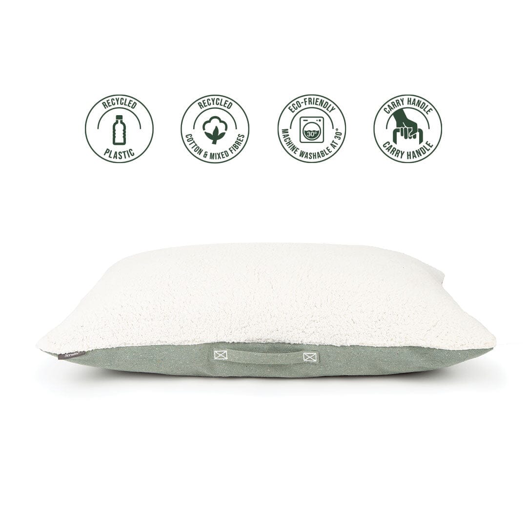 White pillow with green accent on a white background, featuring eco-friendly icons.