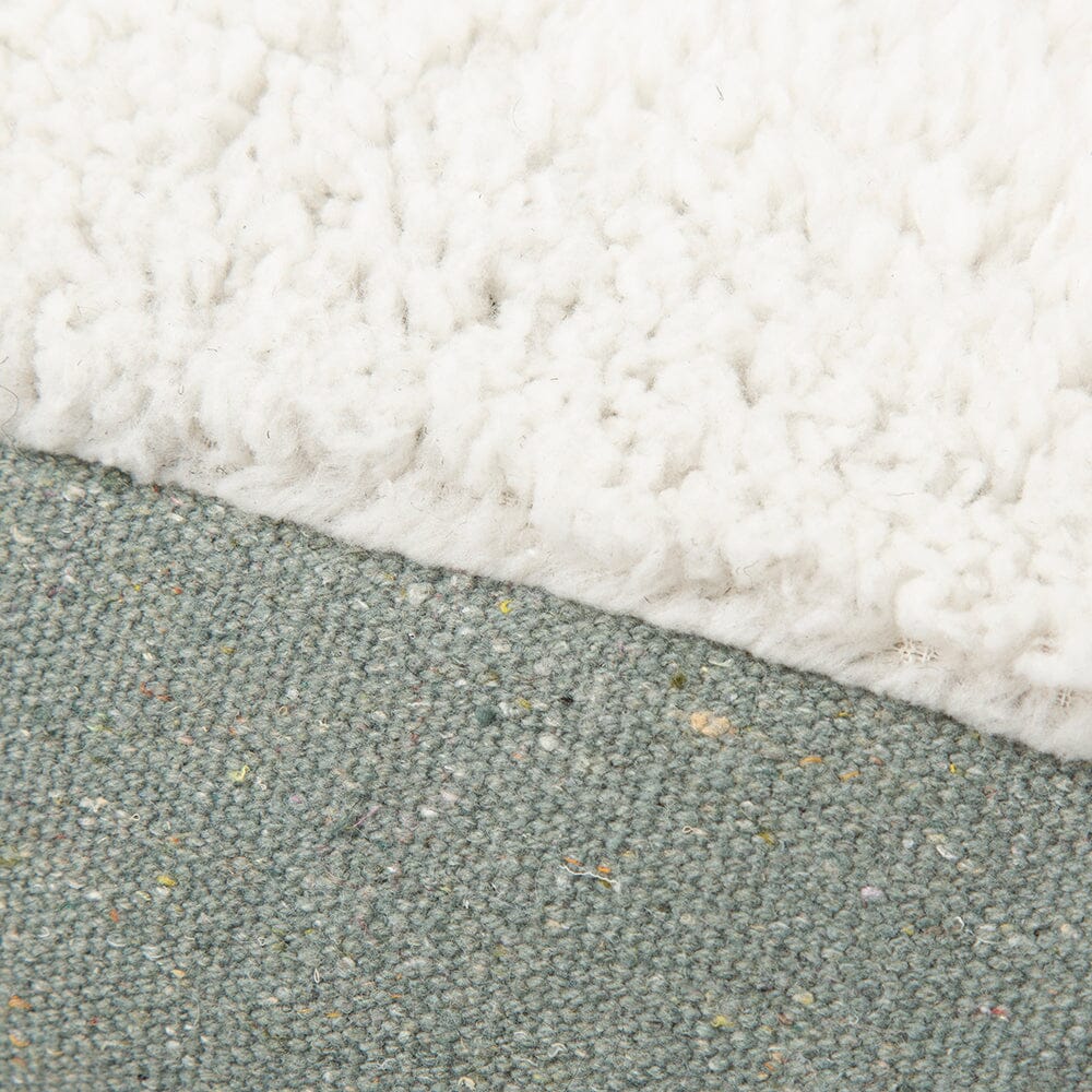 Close-up of a textured surface with white and green colors