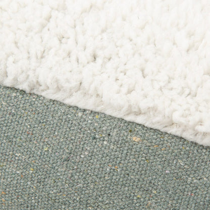 Close-up of a textured surface with white and green colors