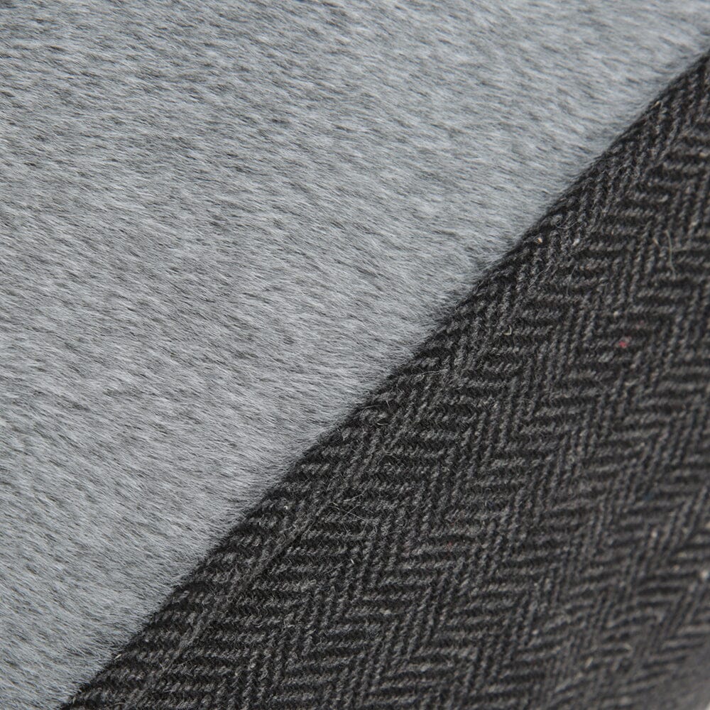 Close-up of gray fabric with a herringbone pattern
