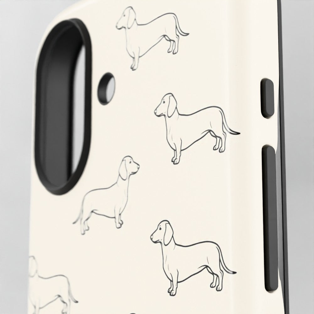 Close-up of a phone case with a cream background and black line-art illustrations of dachshunds, showing the camera cutout and side button areas.