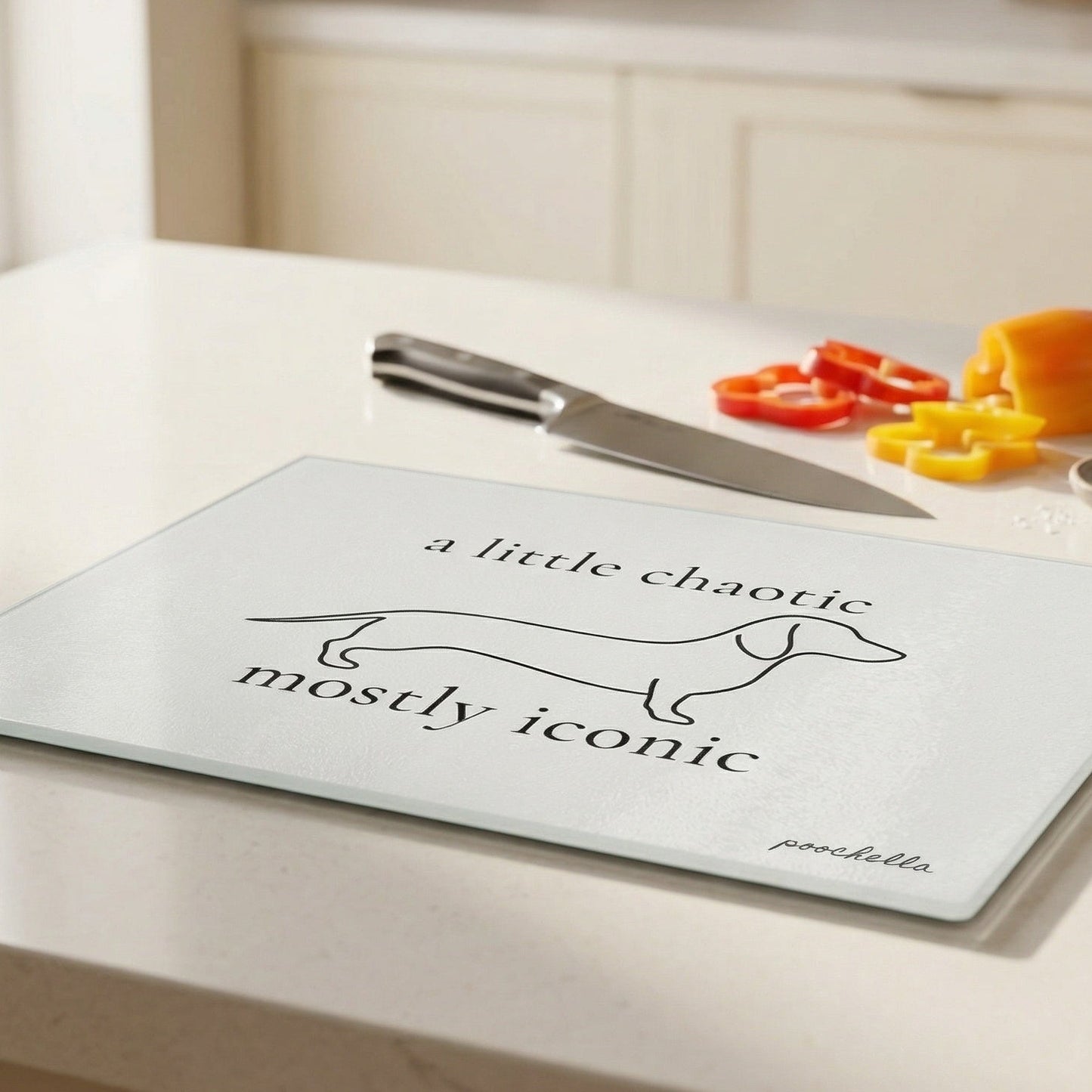 Chopping board with dachshund design and text on a kitchen counter