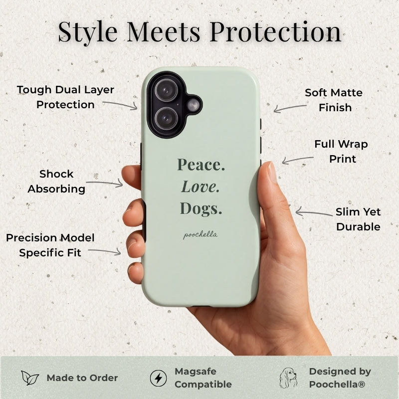 A hand holds a pale mint phone case with the words 'Peace. Love. Dogs.