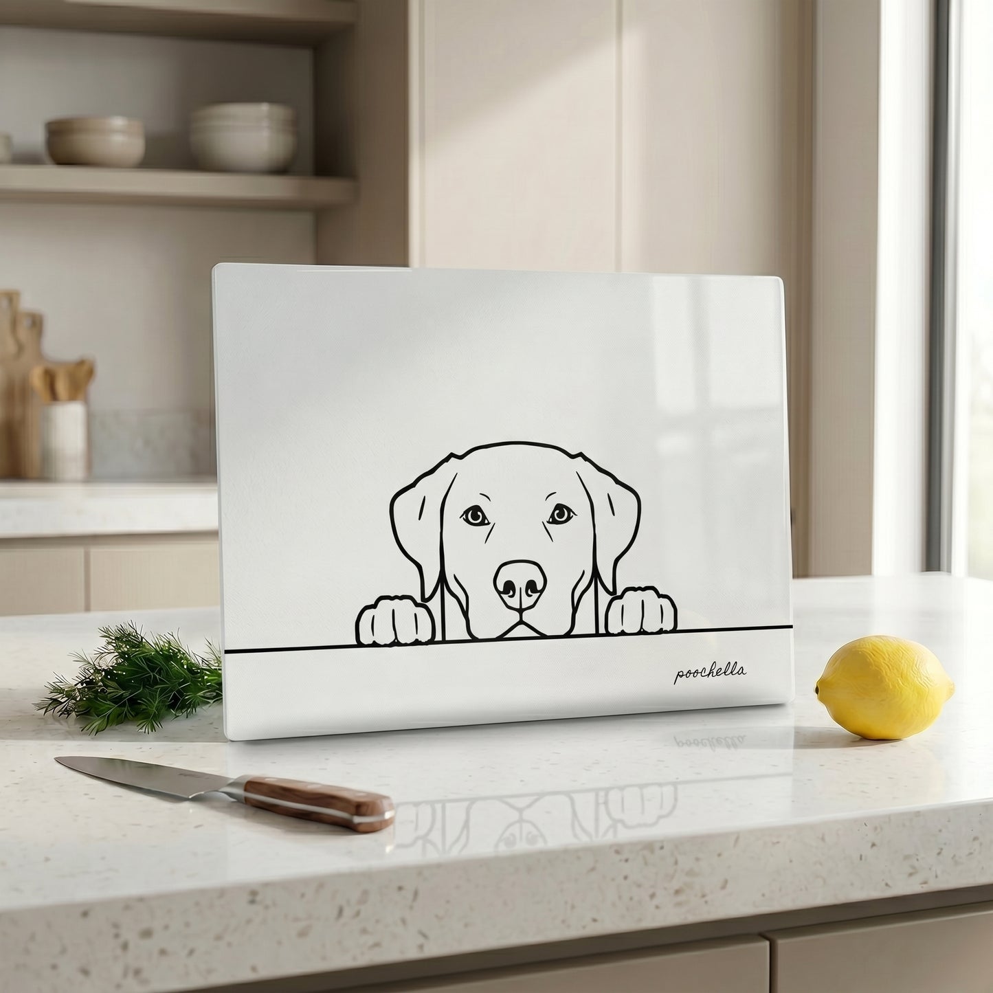 White cutting board with a dog illustration on a kitchen counter