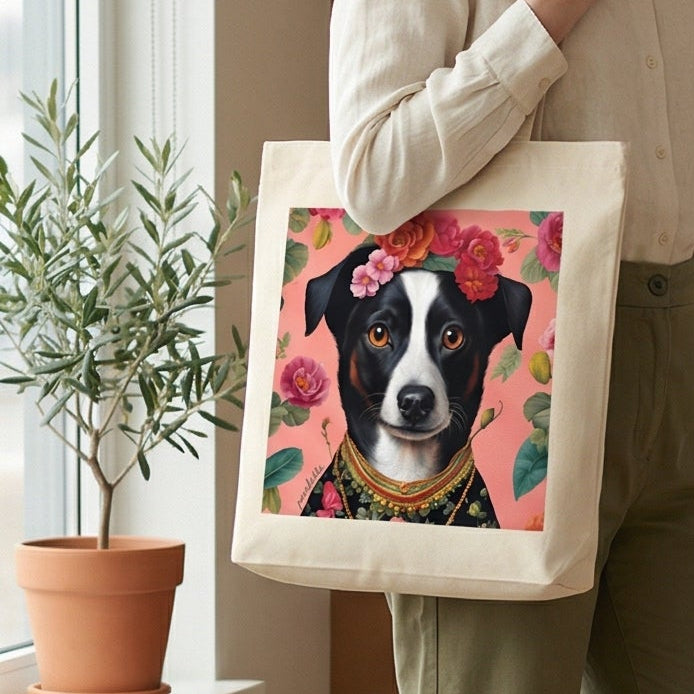 Woman holding a tote bag with a dog design in a room with a couch and plants.