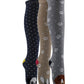 Three pairs of knee-high socks with dog and paw print patterns on a white background.