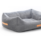 Gray pet bed with orange accents on a white background