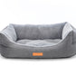 Gray pet bed with a visible brand logo on a white background