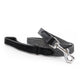A black and gray herringbone patterned dog leash with a black leather handle and silver metal snap hook, displayed on a clean white background.