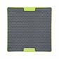 Gray and green lick mat for dogs with a white background
