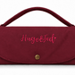 A burgundy nylon clutch bag with a top handle, featuring the embroidered pink text 'Hugo&Ted' on the front flap and a gold snap button closure.