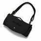 A black Hugo & Ted crossbody  folding dog travel mat bag with a curved flap, embossed logo, and gold-tone hardware, shown on a white background.