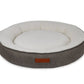 Round pet bed with gray exterior and white interior on a white background