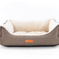Dog bed with beige fabric and white interior on a white background