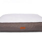 Dog bed with brown tweed fabric exterior and white cushion on a white background